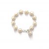 dainty pearl wedding bracelet on a white background