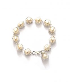 dainty pearl wedding bracelet on a white background