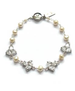 modern luxury diamante and pearl wedding bracelet on a white background