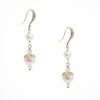 . Image showing Long pearl drop wedding earrings in gold on a white background