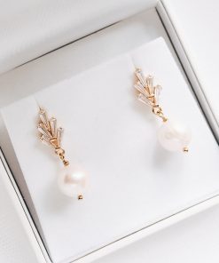 Sylvie Crystal Earrings. Image of art deco gold studs with freshwater pearl drops
