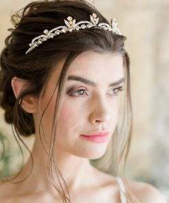 Bride wearing a delicate pearl and crystal tiara
