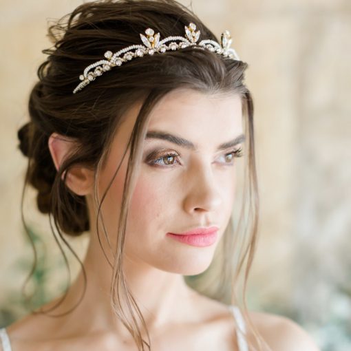Bride wearing a delicate pearl and crystal tiara
