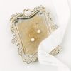 Classic bridal real pearl drop earrings placed on a gold plate with silk ribbon