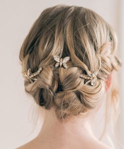 DAMSELFLIES and BUTTERFLY hairpins. Image shows back of brides head, with blonde hair up in a braided bun, with butterfly and dragon fly hairpins