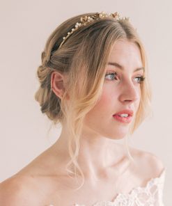 Bride in her wedding dress looking to her left in a bridal crown