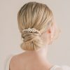 Juliette Pearl Comb. Image showing woman with a low bun and a small pearl hair comb.