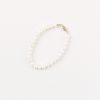 traditional real pearl bridal bracelet on beige background
