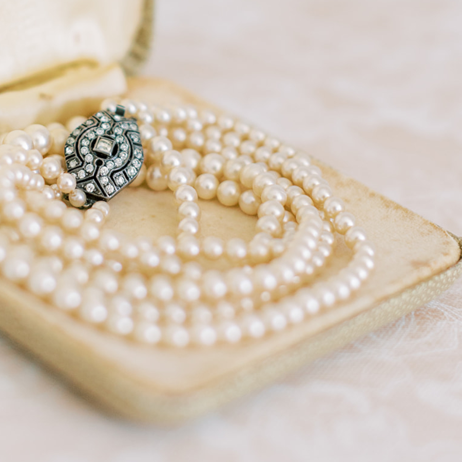 vintage box with a set of pearls and diamante clasp