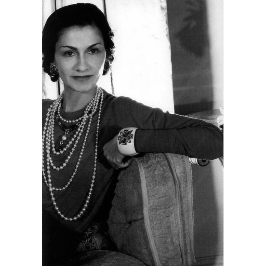 Coco Chanel wearing pearls