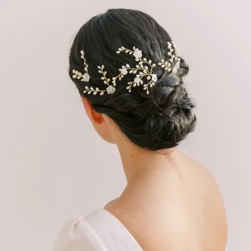 Aphrodite Floral Hair Pin - Image shows woman with low bun and lots of floral hair pins in