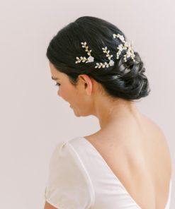 Image shows woman wearing Wedding hair pins for bridal buns.
