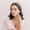 Hazel Bridal Crown - bride with ivory gown. She has long hair down in waves wearing a gold tiara.