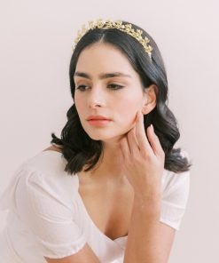Hazel Bridal Crown - bride with ivory gown. She has long hair down in waves wearing a gold tiara.