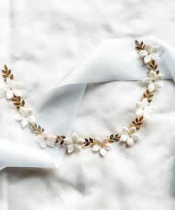 flat image of gold leaf and ivory coloured flower hair vine