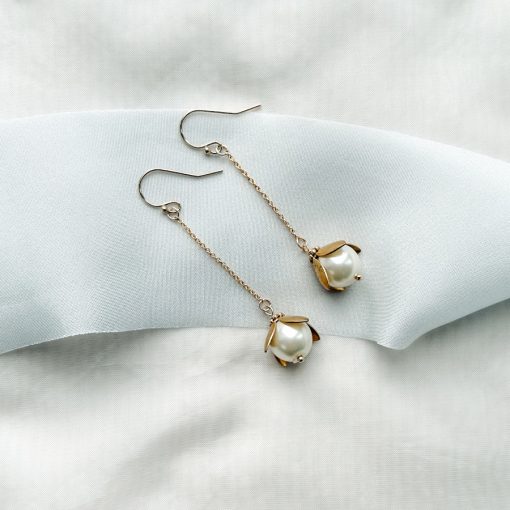 Rosalind pearl drop earrings - image showing long chain style earrings with large pearl drop at the end in gold