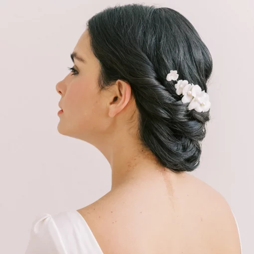 Saffron Floral Bridal Hair comb - Image shows woman with low bun and Flower hair comb