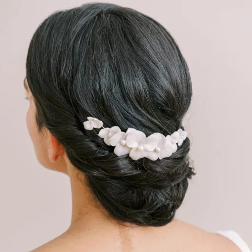 Saffron Floral Bridal Hair comb - Image shows woman with low bun and Flower hair comb