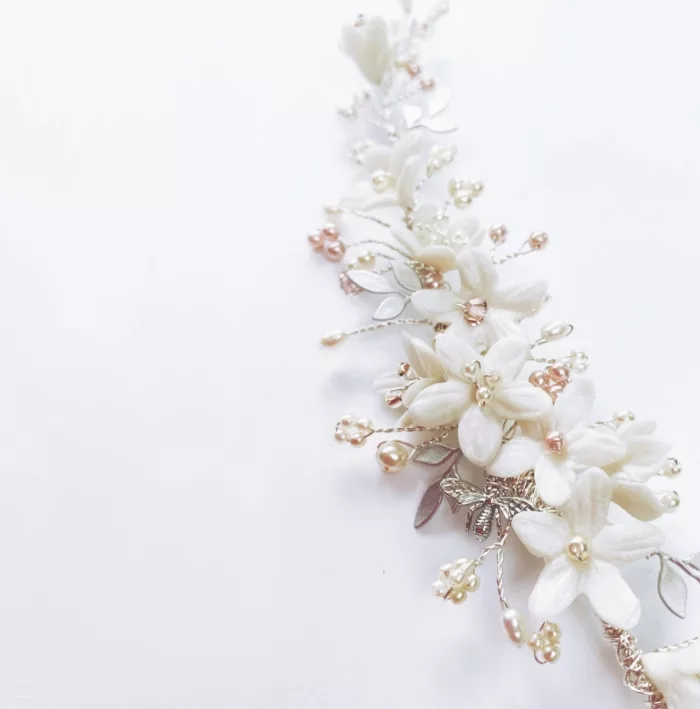 Bespoke floral bridal hair comb for bride; clustered with ivory coloured flowers, blush pink pearls and crystals.